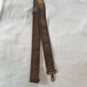 Soretro guitar style purse strap.
